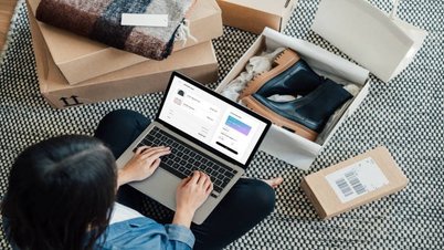 A woman browsing an e-commerce website, exploring products to enhance her shopping experience and increase store profitability.